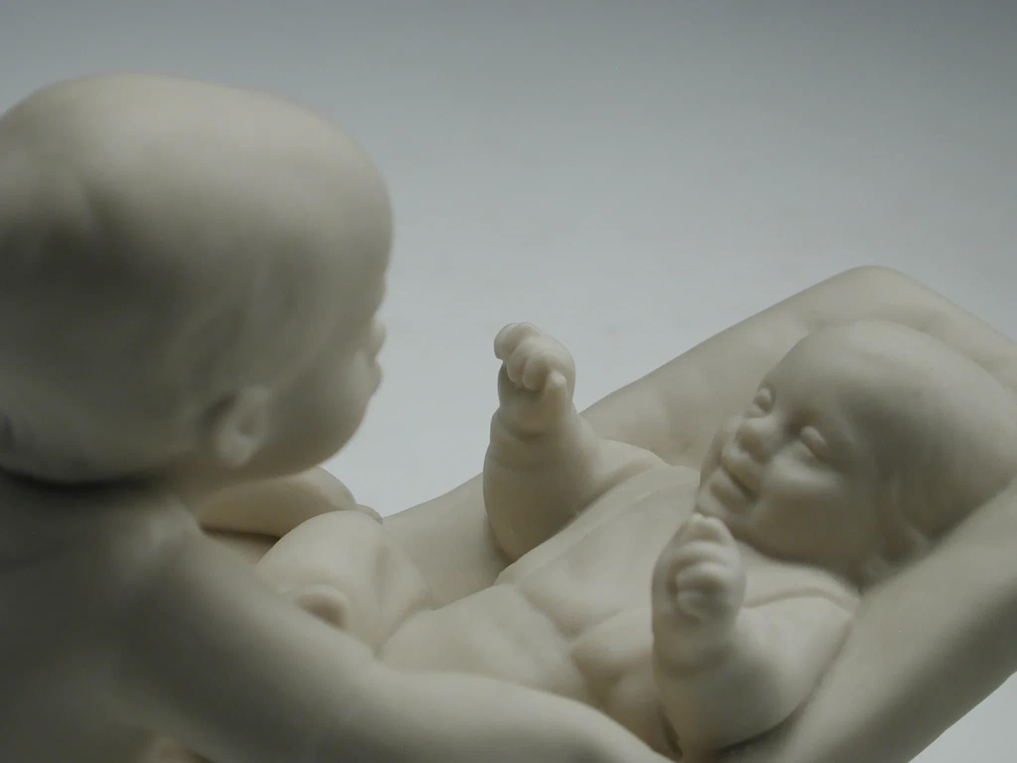 Close-up detail of Brotherly Love porcelain figurine